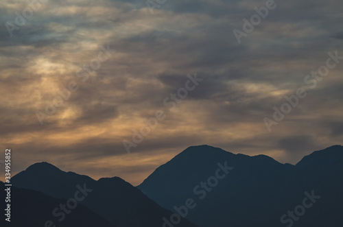 Scenic View of Silhouette Mountains against Sky during Sunset