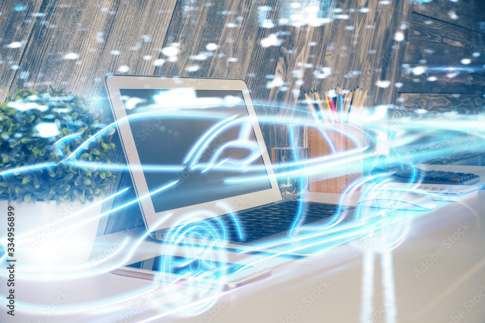 Desktop computer background in office with automobile hologram drawing. Multi exposure. Tech concept. Desktop computer background in office with automobile hologram drawing. Multi exposure. Tech concept.