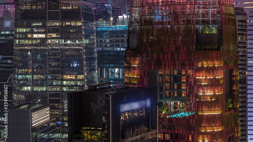 Aerial cityscape of Singapore downtown of modern architecture with skyscrapers night timelapse