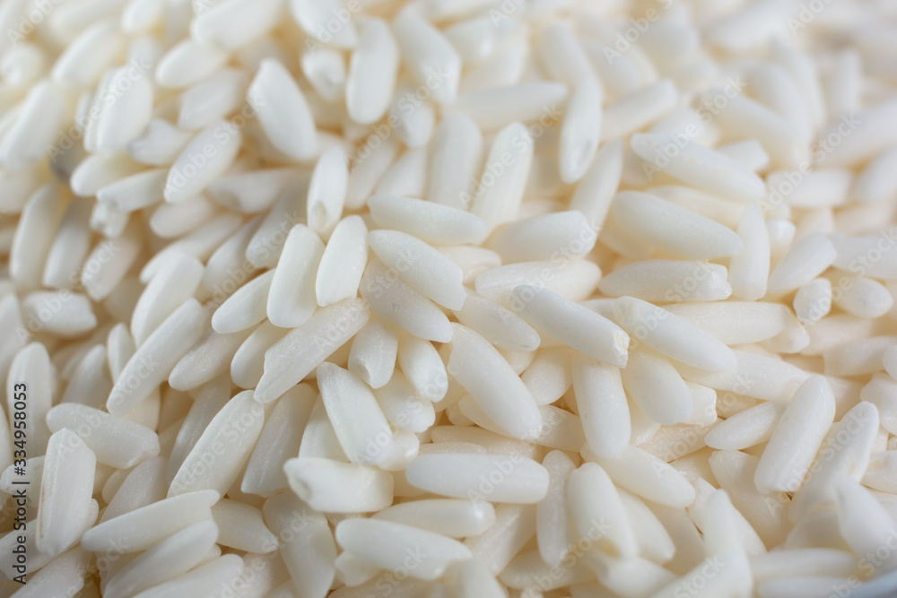 A macro closeup view of raw sticky rice, as a background. A macro closeup view of raw sticky rice, as a background.