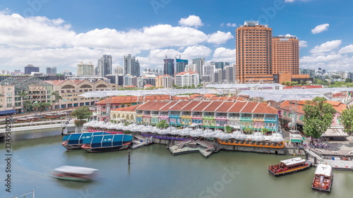 Photography Tourist boats docking at Clarke Quay habour aerial timelapse.