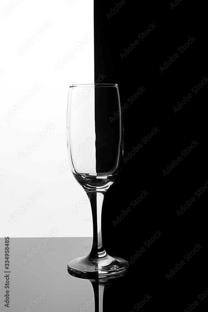 Glass champagne glass on a black and white background