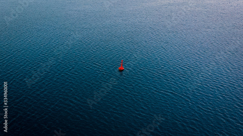 Photography A buoy floating gently on the surface of the Adriatic sea
