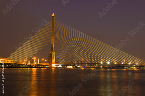 View of King Rama VIII Bridge in the evening illumination. Bangkok, Thailand