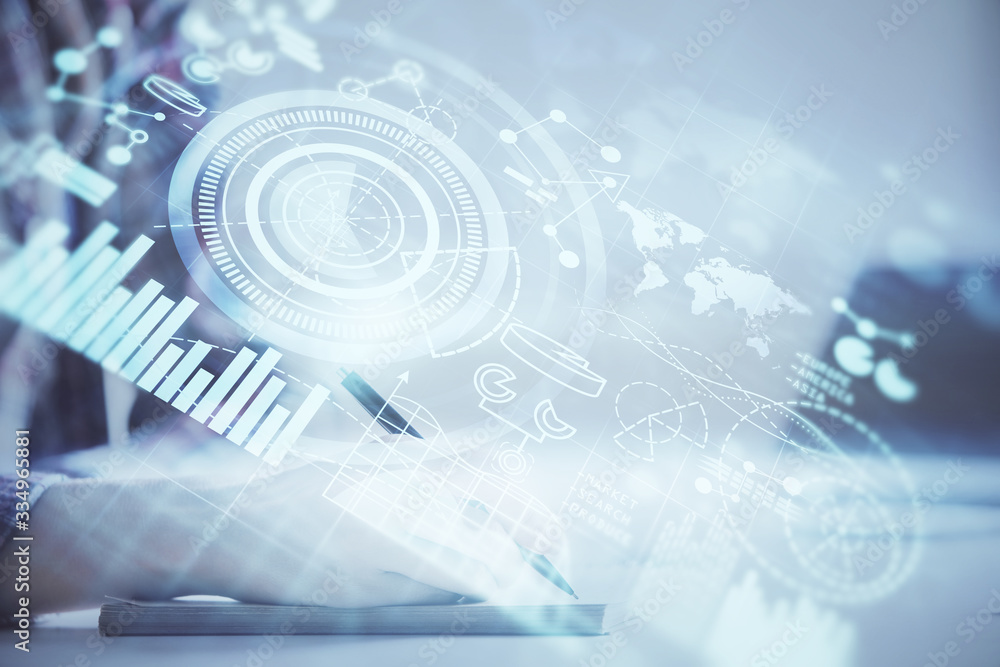 International business hologram over hands taking notes background. Concept of success. Multi exposure International business hologram over hands taking notes background. Concept of success. Multi exposure