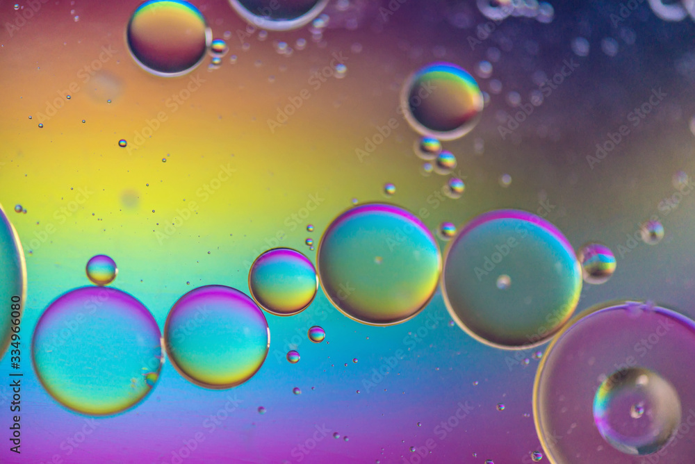 Oil drops in water. Abstract psychedelic pattern image multicolored. Abstract background with colorful gradient colors. DOF Oil drops in water. Abstract psychedelic pattern image multicolored. Abstract background with colorful gradient colors. DOF