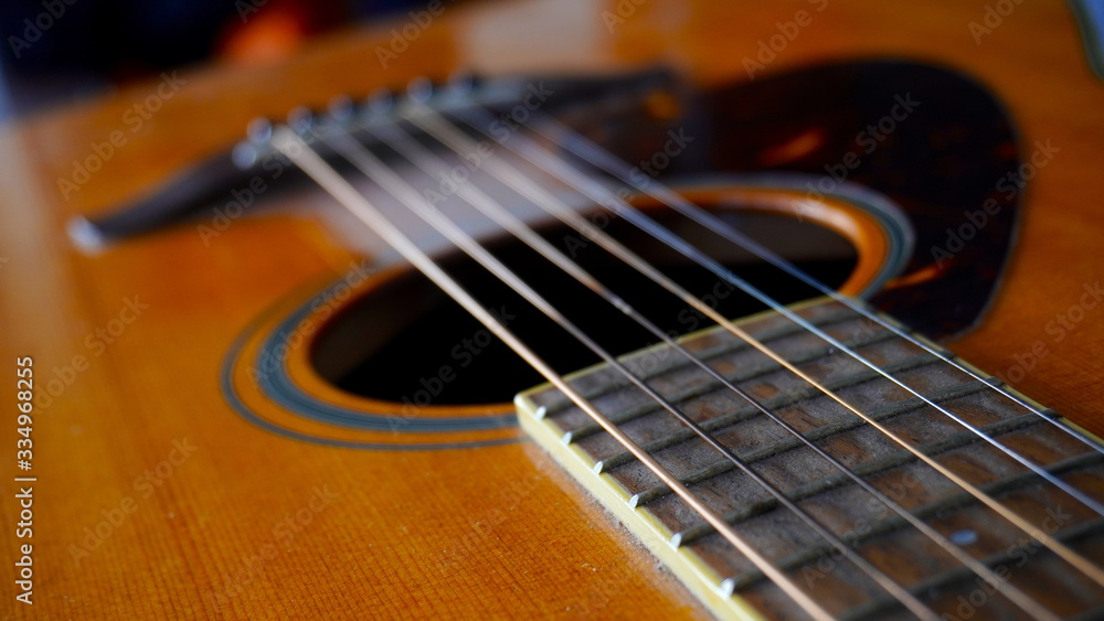 Fototapeta premium Close up macro on guitar strings. Musical instrument concept idea. Music and sound