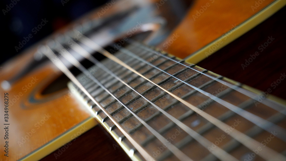 Close up macro on guitar strings. Musical instrument concept idea. Music and sound Close up macro on guitar strings. Musical instrument concept idea. Music and sound