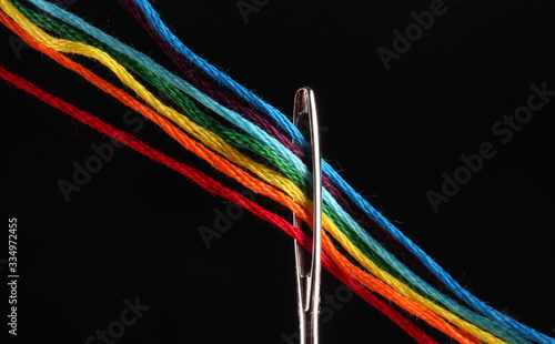 Fotografija bright iridescent thread floss for embroidery and needlework