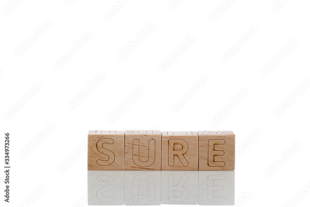 Wooden cubes with letters sure on a white background Wooden cubes with letters sure on a white background