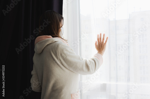 Girl in self-isolation from the coronavirus. The girl in the medical mask Free Download Girl in self-isolation from the coronavirus. The girl in the medical mask - GFXLoad