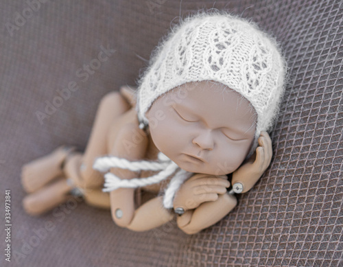 Mannequin of newborn for photo posing