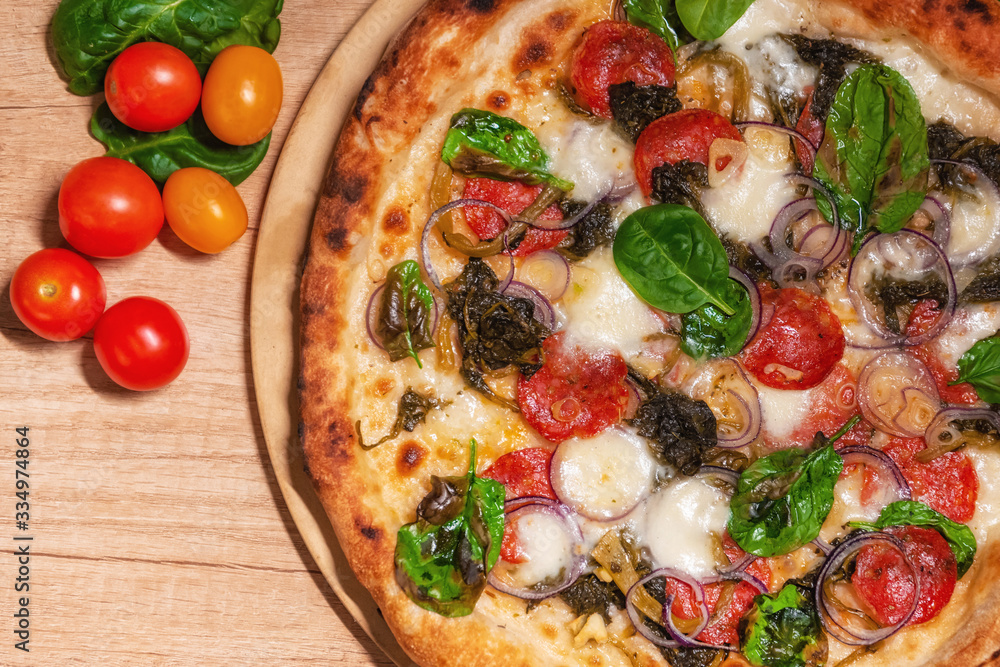 Delicious baked pizza and vegetables Delicious baked pizza and vegetables