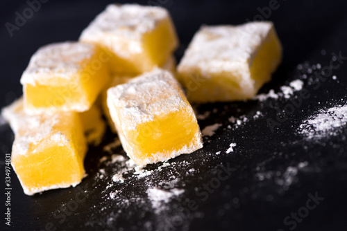 Sweet pieces of yellow turkish delight .