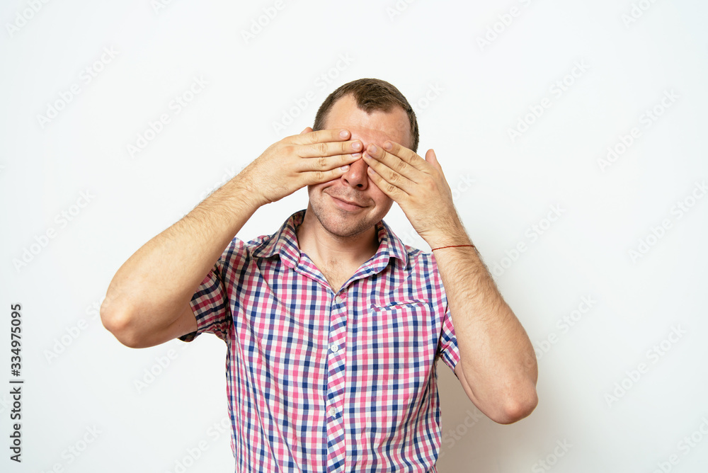 Man covering his face Man covering his face
