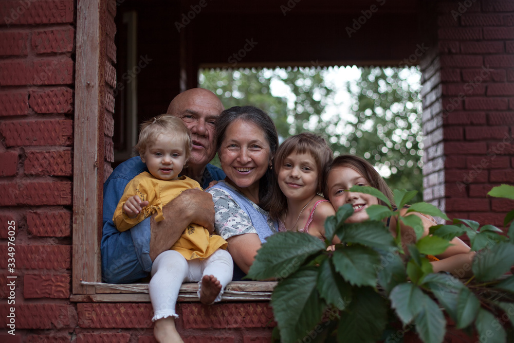 Portrait of happy pensioners with grandchildren Portrait of happy pensioners with grandchildren