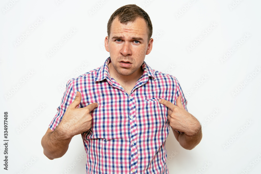 Male hand forefinger pointing to himself on the chest. Gesture. who am i. On a gray background Male hand forefinger pointing to himself on the chest. Gesture. who am i. On a gray background