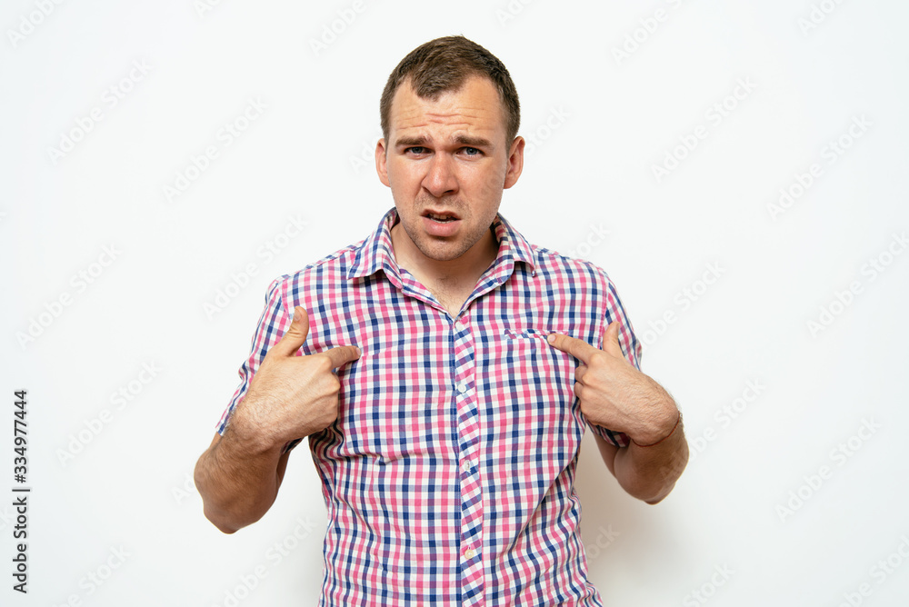 Male hand forefinger pointing to himself on the chest. Gesture. who am i. On a gray background Male hand forefinger pointing to himself on the chest. Gesture. who am i. On a gray background