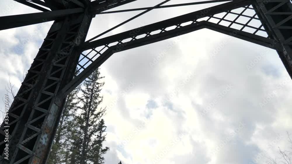 Pan Down From Metal Bridge to Mountain Range. Pan Down From Metal Bridge to Mountain Range.