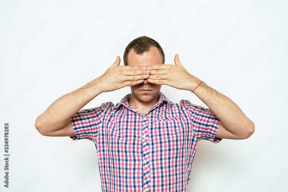 Man closes eyes with her hands Man closes eyes with her hands
