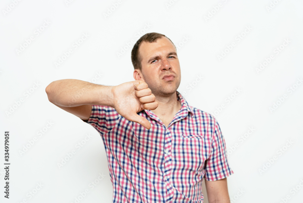 man showing a thumb down gesture man showing a thumb down gesture