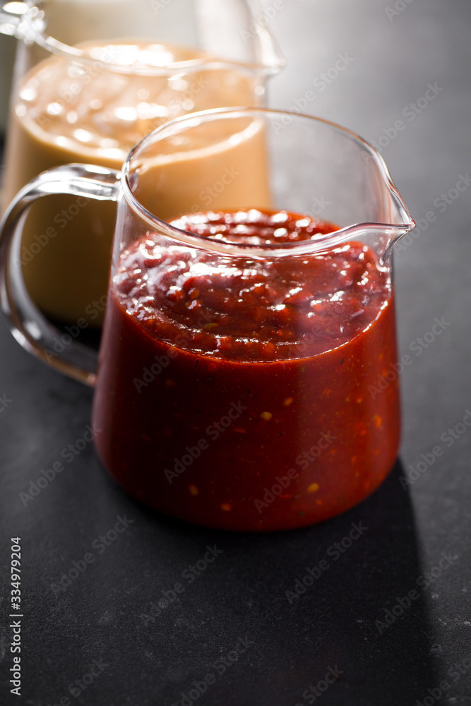 tomato sauce in a glass pitcher