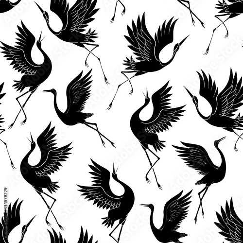 Japanese pattern. Seamless vector ornament with traditional motives. Japanese pattern with storks and sakura.