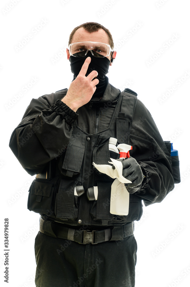 Concept concept Isolated portrait on a white background man in black military uniform with cleaning products in his hands Concept concept Isolated portrait on a white background man in black military uniform with cleaning products in his hands