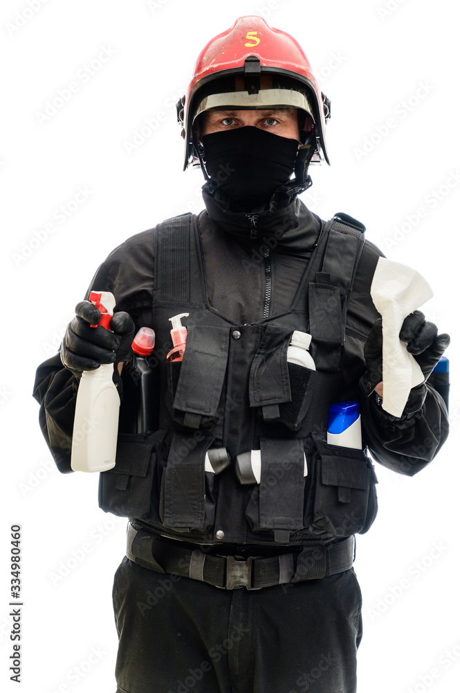 Concept Isolated portrait on white background man in a black military uniform in a red helmet with cleaning products in his hands Concept Isolated portrait on white background man in a black military uniform in a red helmet with cleaning products in his hands