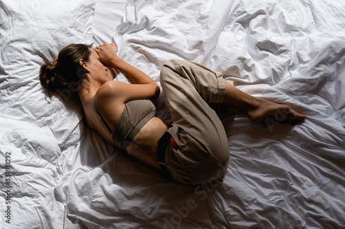 young woman sleeping in bed