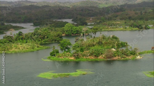 Aerial view of Lake Bayano, small islands with palms and cloud forest in Panama Central America, filmed with Cineflex stabilization camera system photo