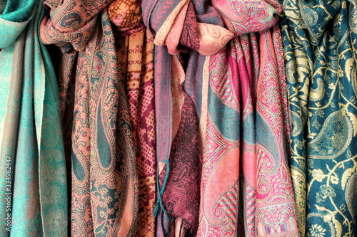 A photograph of a bundle of colorful scarves. Women's fashion. 