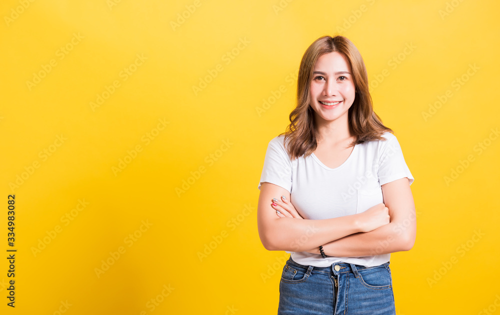 woman teen standing wear t-shirt smile her confidence with crossed arms woman teen standing wear t-shirt smile her confidence with crossed arms