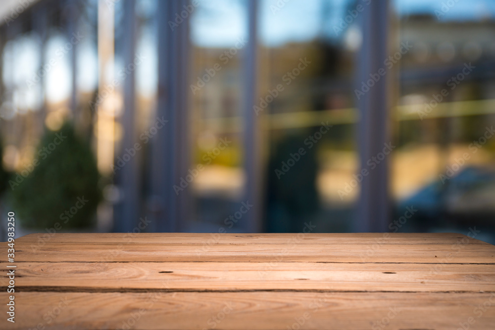 Empty tropical wood table and blurred garden cafe light background. product display template.Business presentation Empty tropical wood table and blurred garden cafe light background. product display template.Business presentation