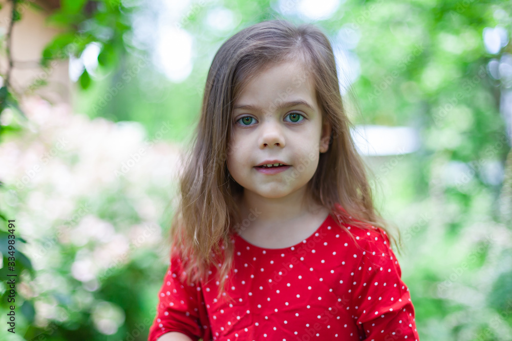 Adorable little girl taken closeup outdoors in summer Adorable little girl taken closeup outdoors in summer