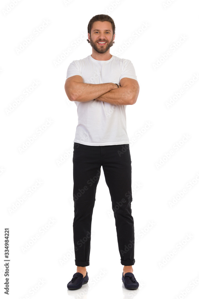 Happy Handsome Man Is Standing With Arms Crossed. Front View. Happy Handsome Man Is Standing With Arms Crossed. Front View.