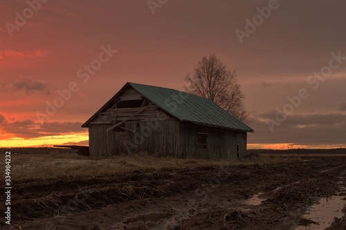 Barn House In The Springtime Sunset