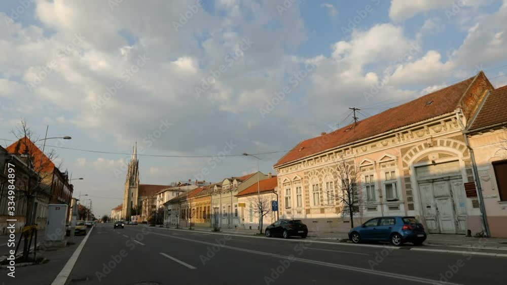 TIME LAPSE - wide empty street during the quarantine due to corona virus with the church at the end of the street TIME LAPSE - wide empty street during the quarantine due to corona virus with the church at the end of the street