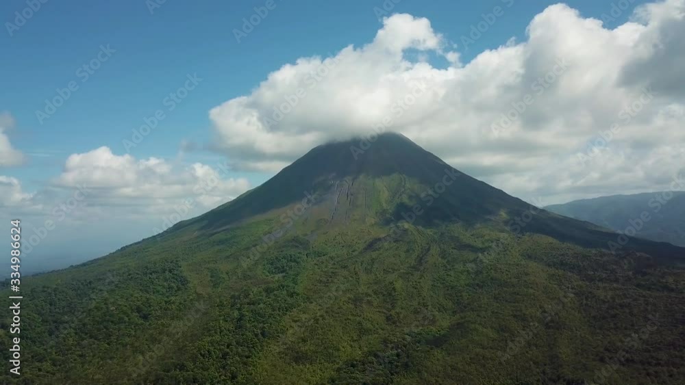 Costa Ricas Vulcano Arenal filmed with drone/aerial, vulcano in clouds with rain forest