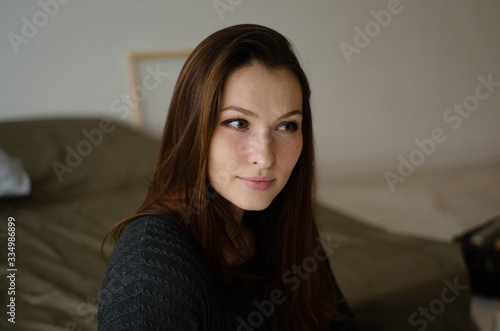  portrait of a young beautiful pensive girl at home