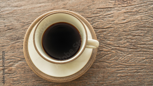black coffee on wooden table. ceramic round cup. background,