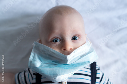 Baby Boy in face mask on white background portrait