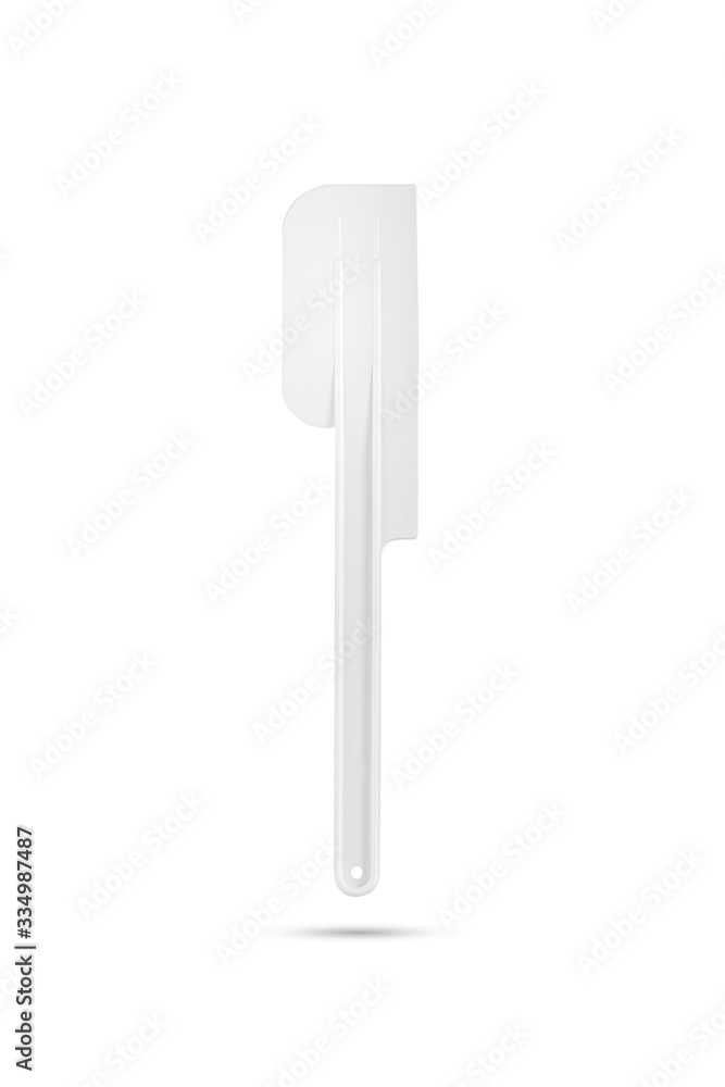 white plastic cake spatula on isolated white background white plastic cake spatula on isolated white background