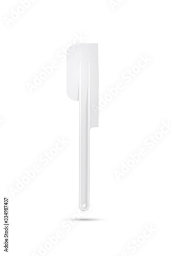 white plastic cake spatula on isolated white background