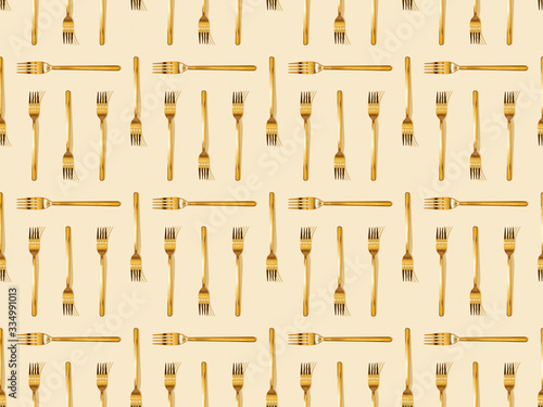 top view of golden forks on beige, seamless background pattern