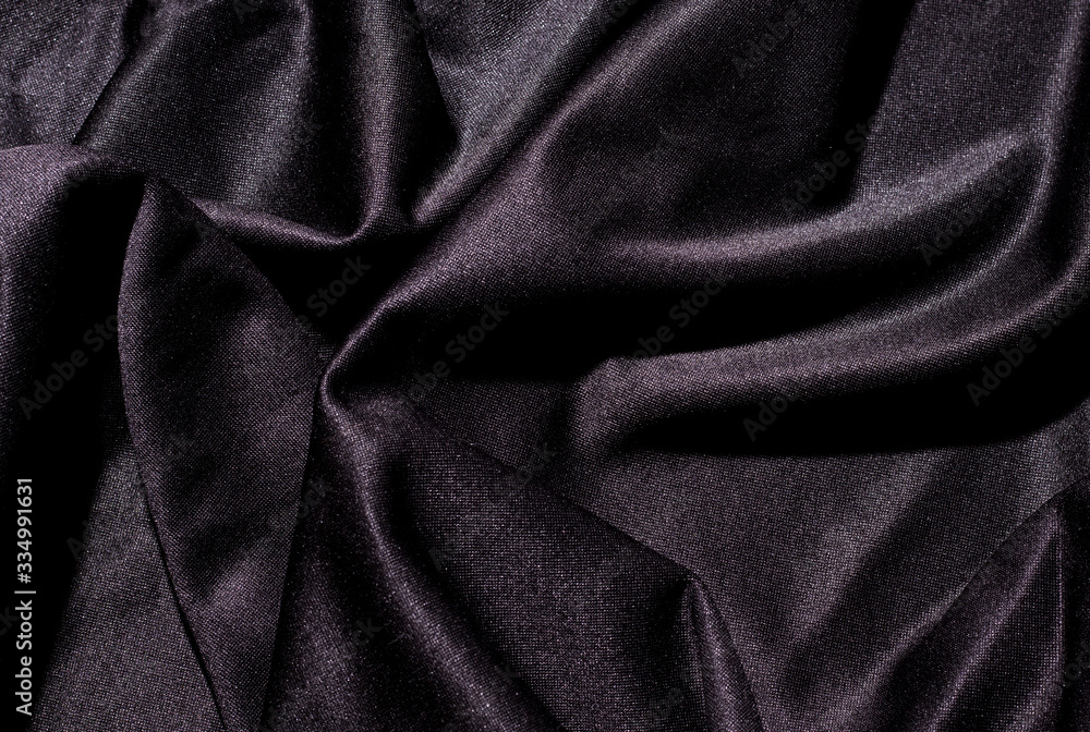Fototapeta premium background texture black fabric lying waves