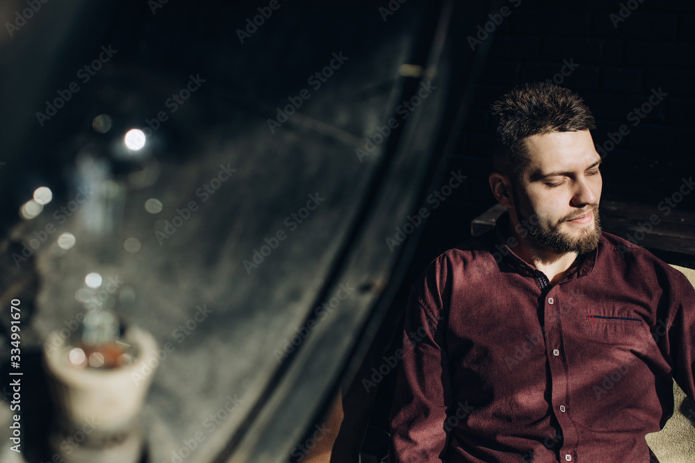 Obraz premium Conceptual portrait of young man closing his eyes