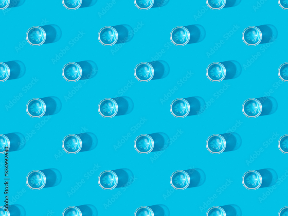 top view of glasses of water on blue, seamless background pattern