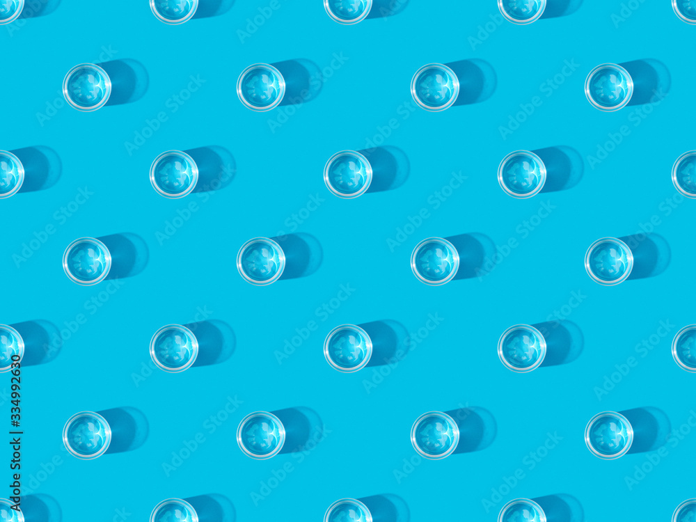 top view of glasses of water on blue, seamless background pattern top view of glasses of water on blue, seamless background pattern