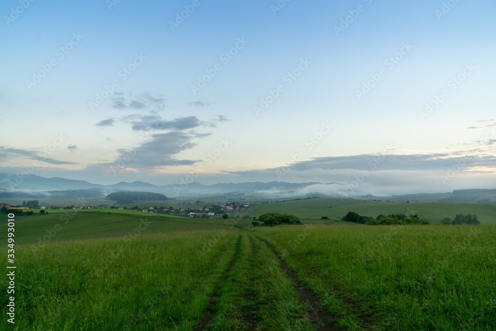 Sunrise or sunset over the hills and meadow. Slovakia